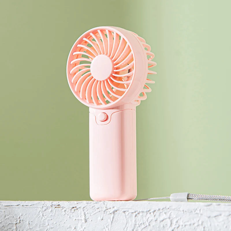 Small Fan + Handheld + Portable with Wrist Strap + Requires AAA Batteries + 1 Speed Setting + Cross-Border Bestseller