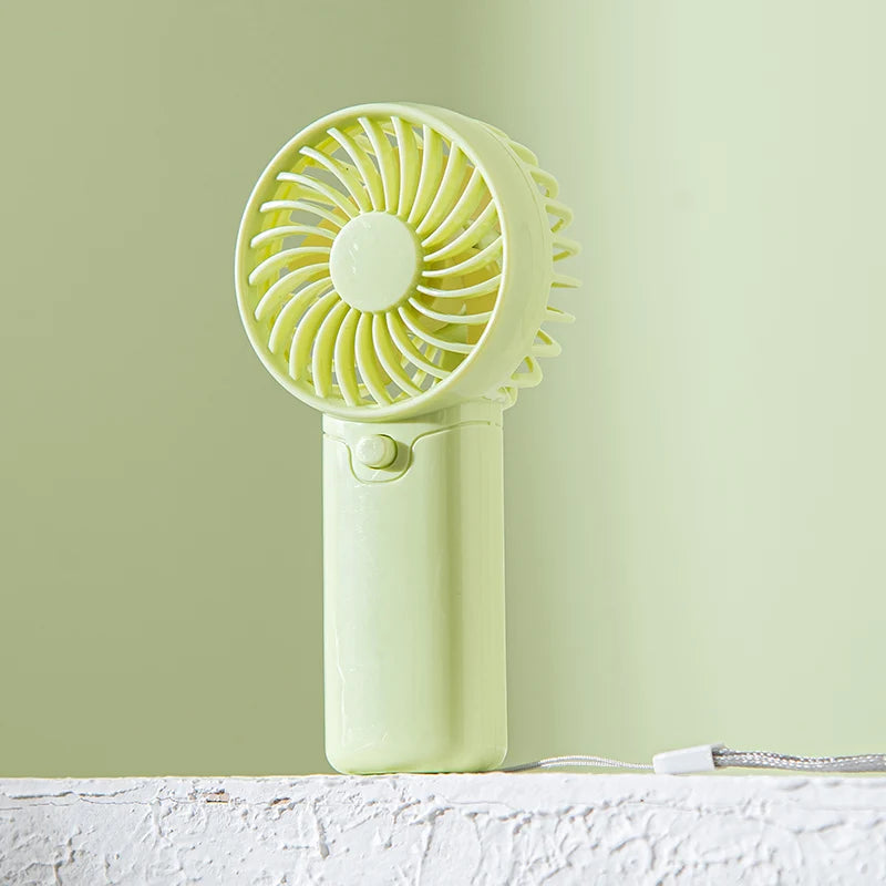 Small Fan + Handheld + Portable with Wrist Strap + Requires AAA Batteries + 1 Speed Setting + Cross-Border Bestseller
